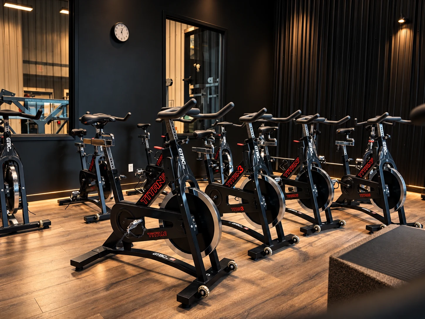 Rows of indoor cycling bikes in the NRG spin studio.